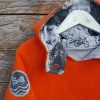 Kid's reversible hoody in orange/light grey - fleece close up